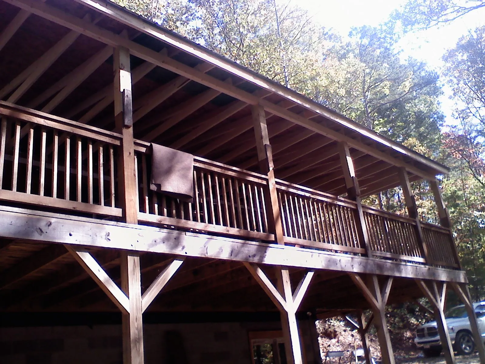 Timber framing under a new elevated porch and deck — Roof Leak Repair in Almo by Roofing Brothers